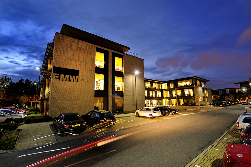 A building with cars parked in front of it