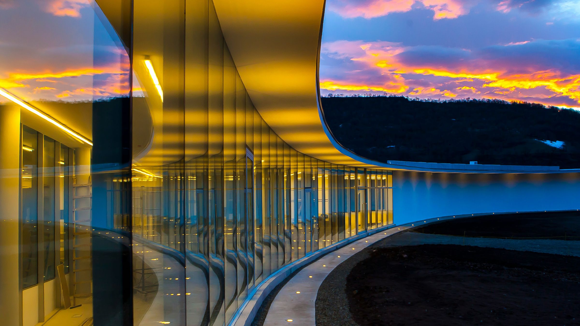 Sweeping circular building with yellow lighting